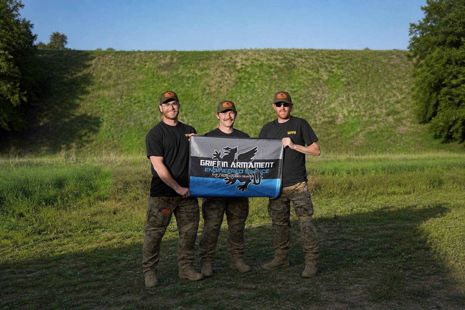 WPPR team members holding Griffin Armament sponsor banner